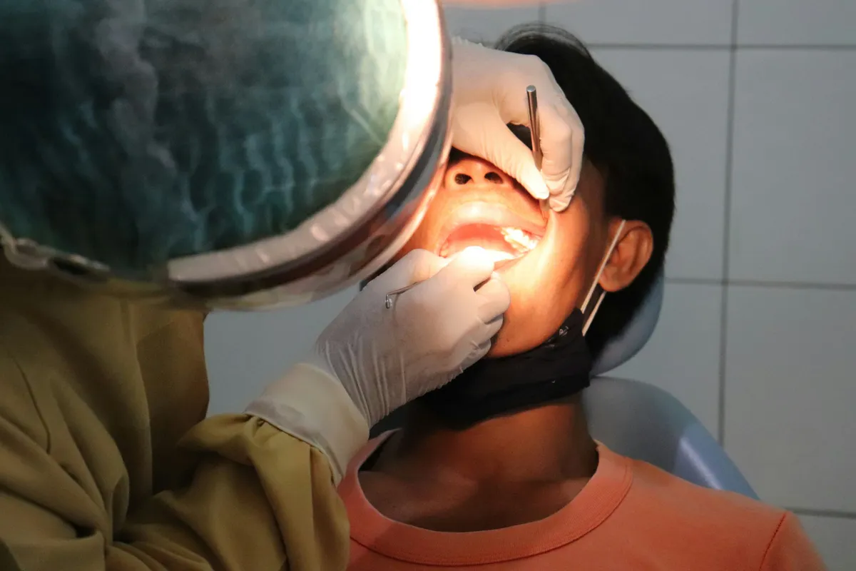 ENT specialist examining a patient